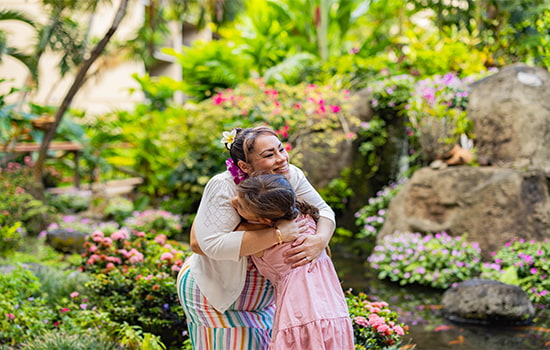 Woman hugging child.
