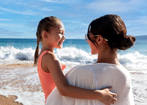 Mother and daughter at the beach.