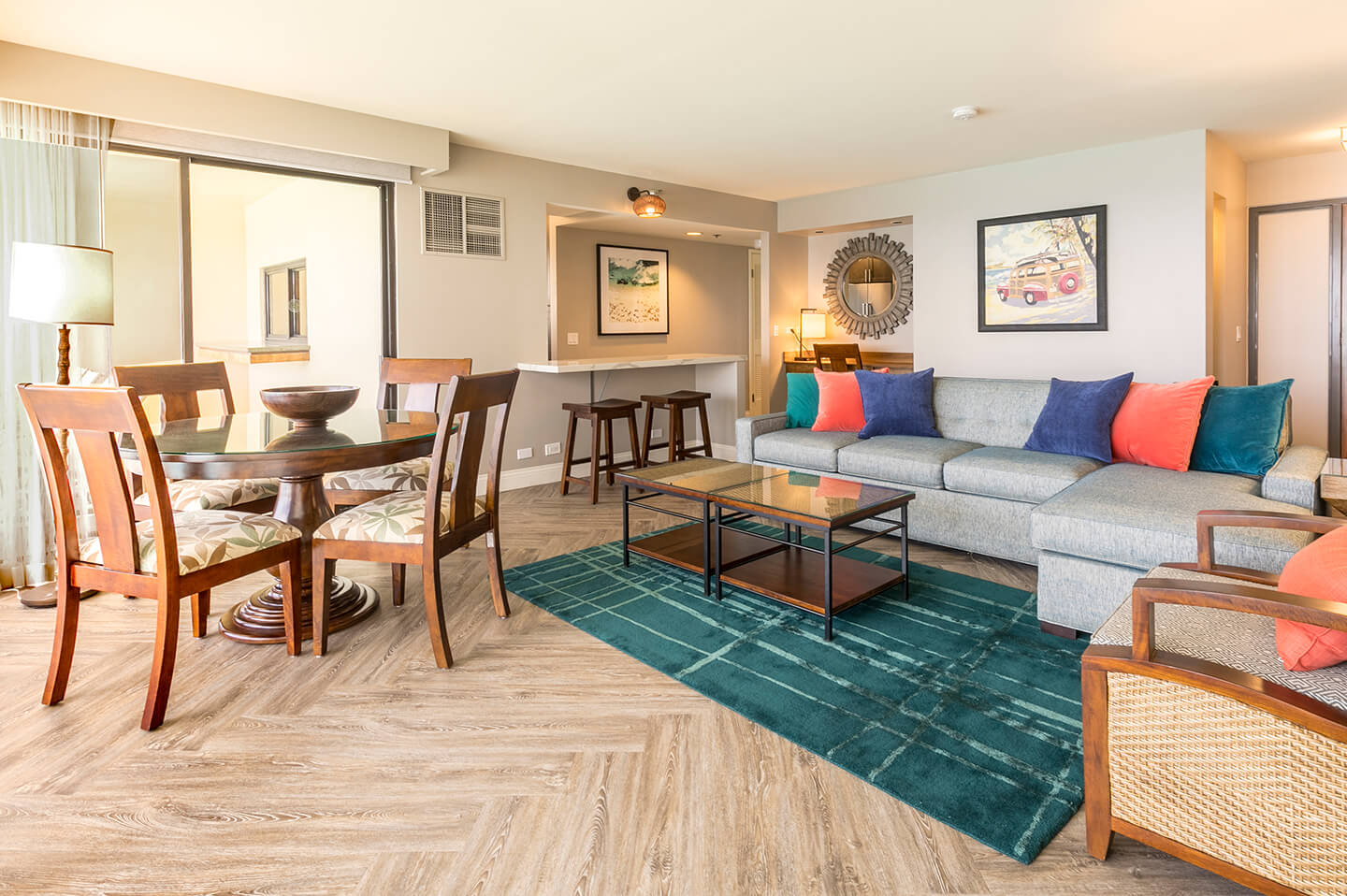 Dining area with table and chairs and living room with couches