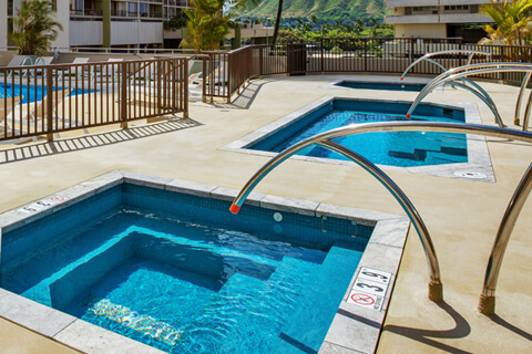 Recreation deck with outdoor hot tub.