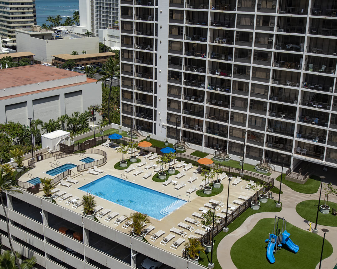 Overhead view of recreation deck including pool and playground.