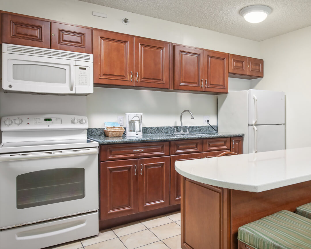 Kitchen with stove, microwave and counterspace.