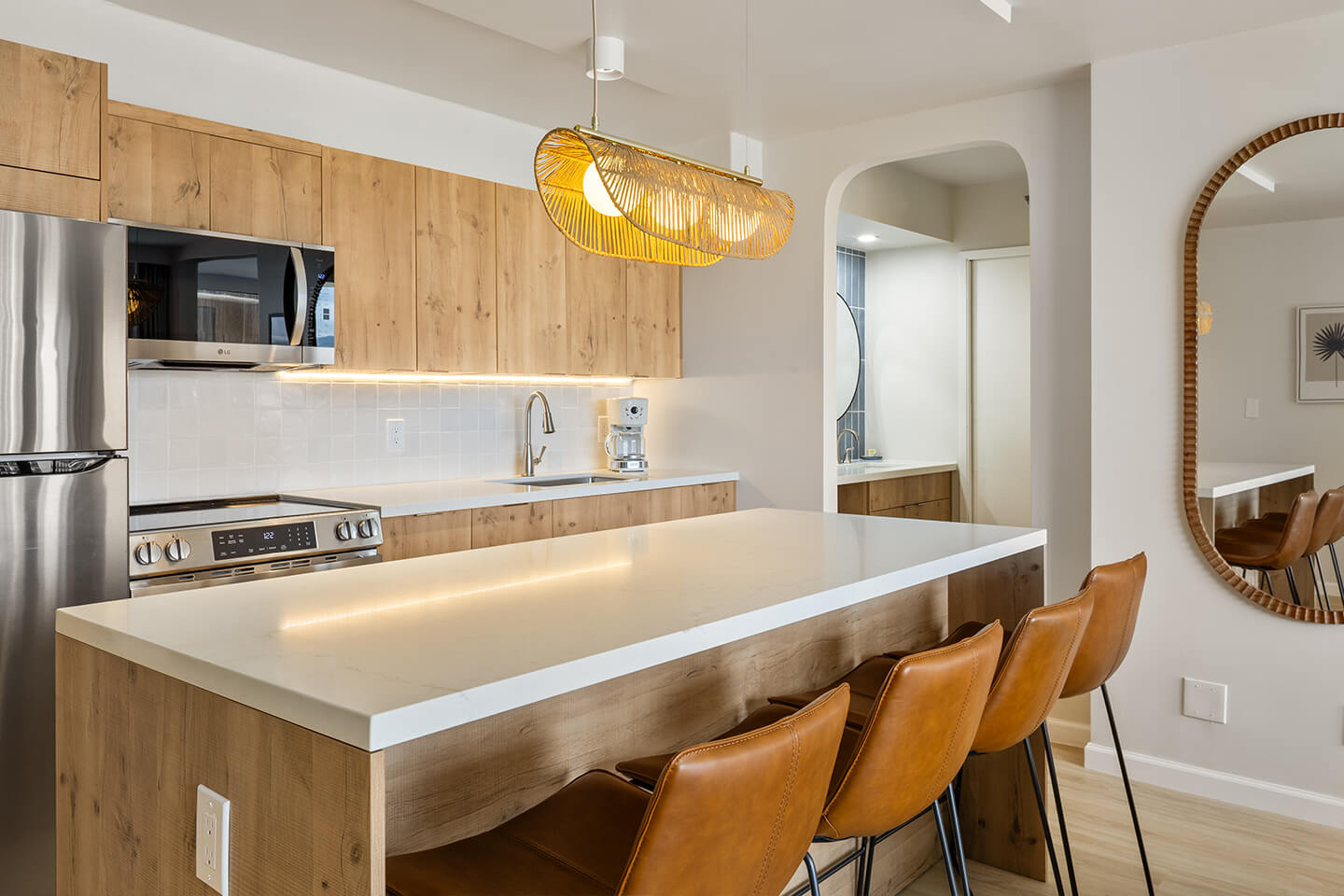 Kitchen with kitchen island and barstools.