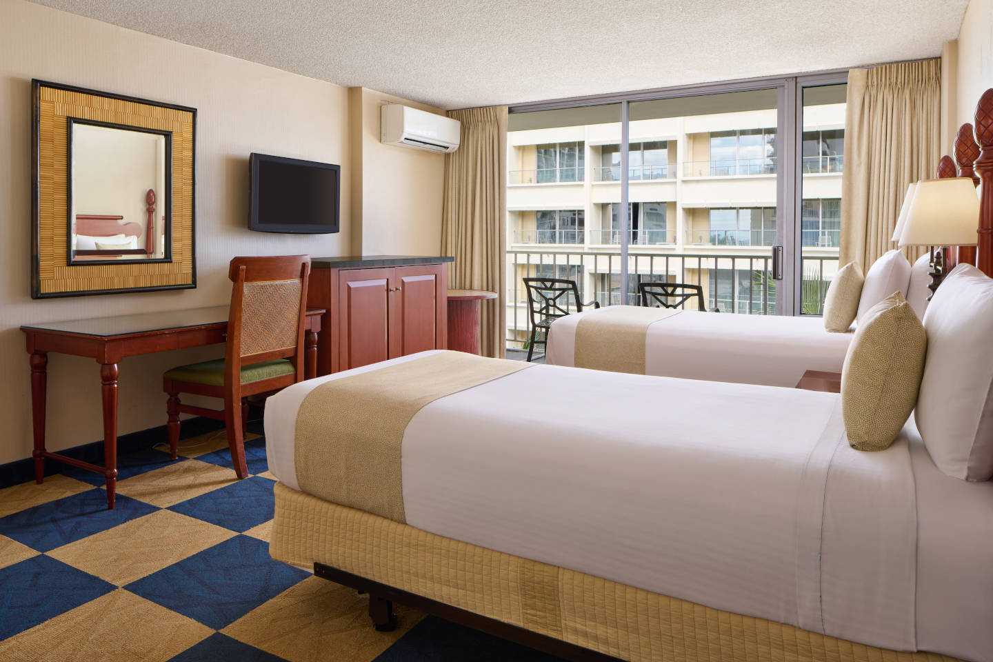 Second room with twin beds and a balcony seating 