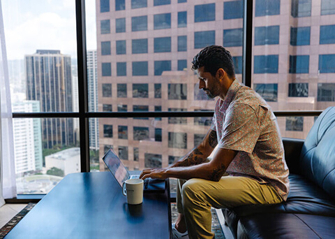 Man working on computer in suite