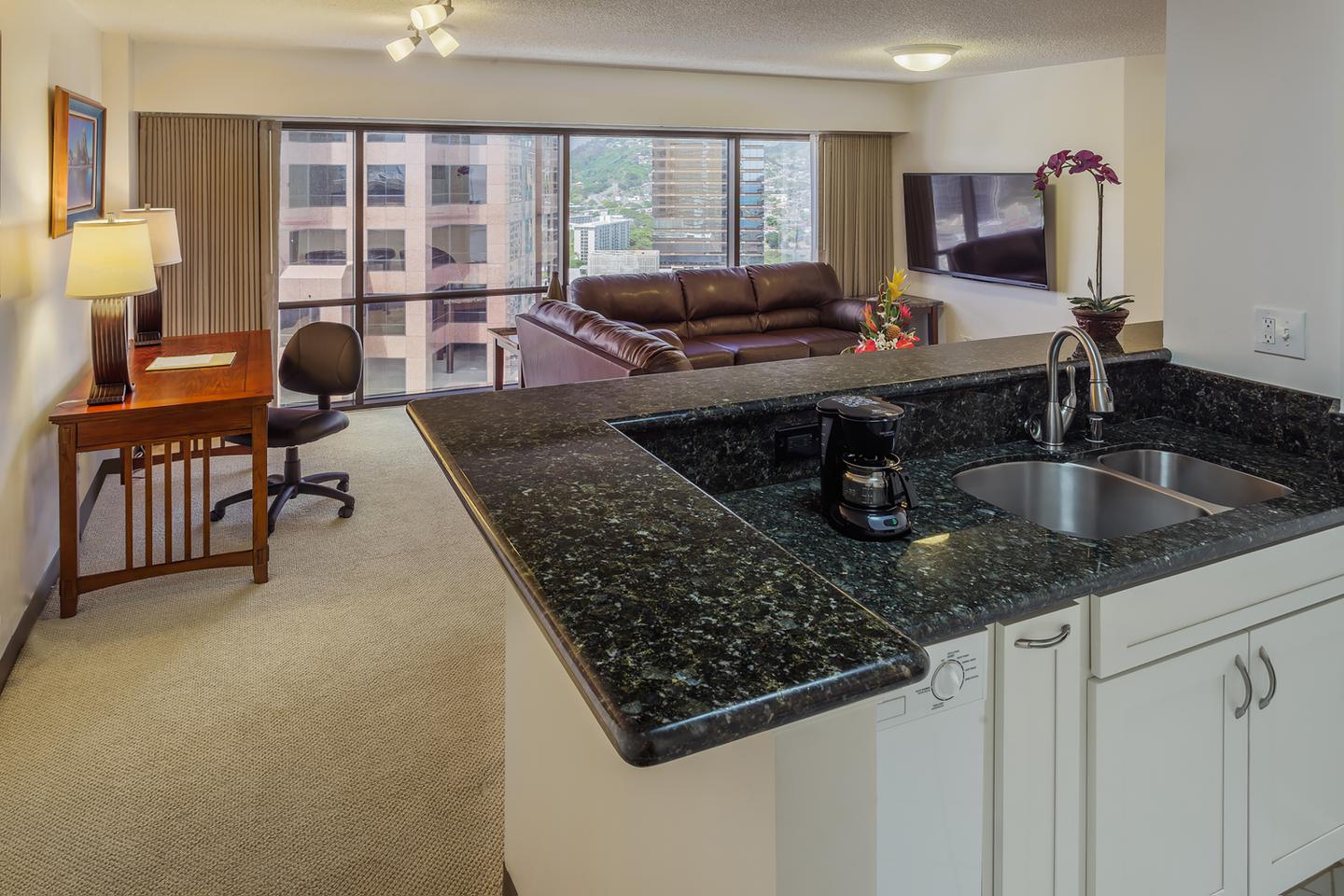 Kitchen, desk, and living area.