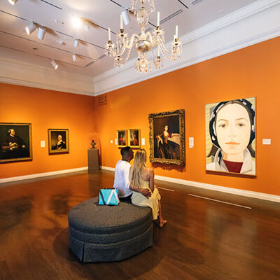 Couple admiring art on wall