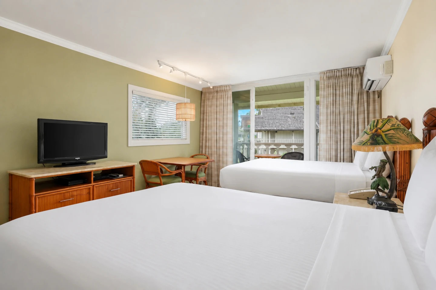 Hotel Room Garden View with bed, night stand and a light