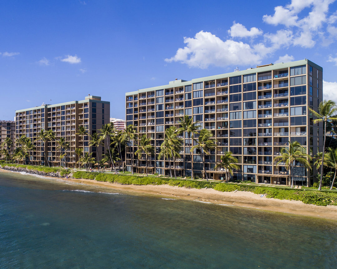 View of the property along the beach and ocean.