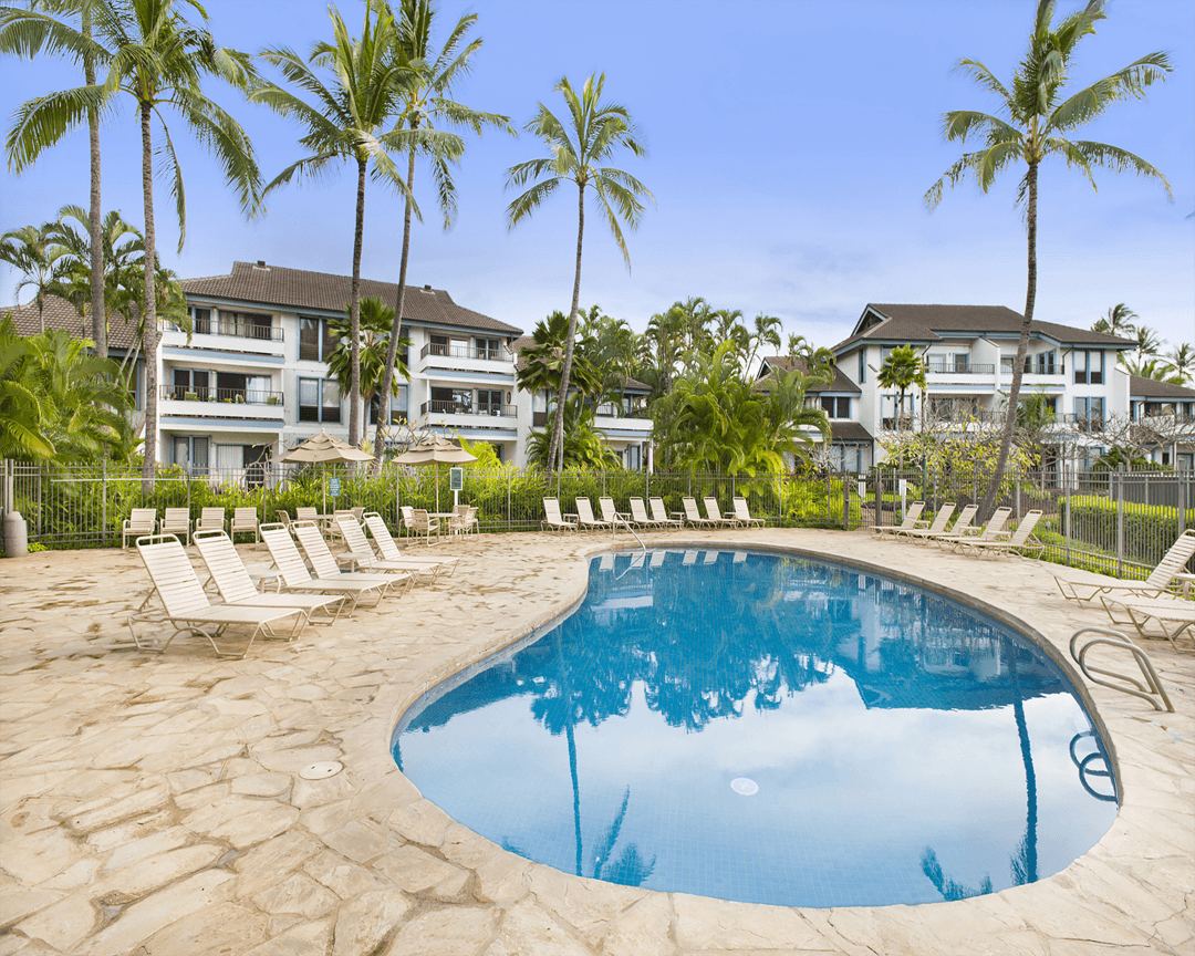 Pool with sundeck and lounge chairs.